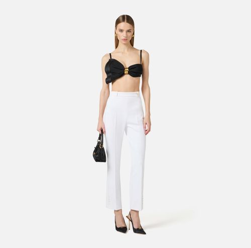 Trousers in double layer stretch crêpe fabric with logo charm