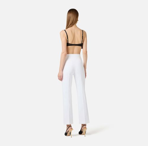 Trousers in double layer stretch crêpe fabric with logo charm