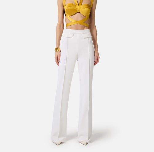 Trousers in double layer stretch crêpe fabric with embroidered logo
