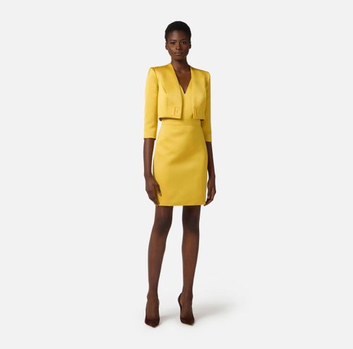 Dress in duchess satin and tulle with jacket