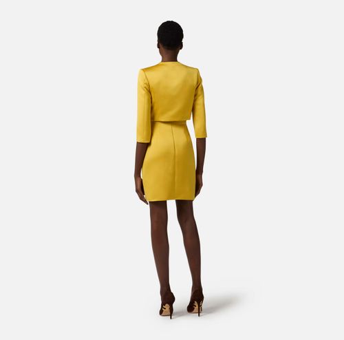 Dress in duchess satin and tulle with jacket