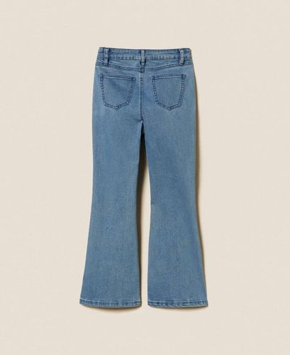 Flared jeans with buttons