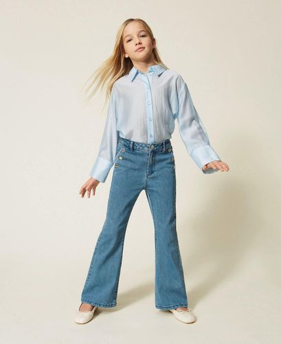 Flared jeans with buttons