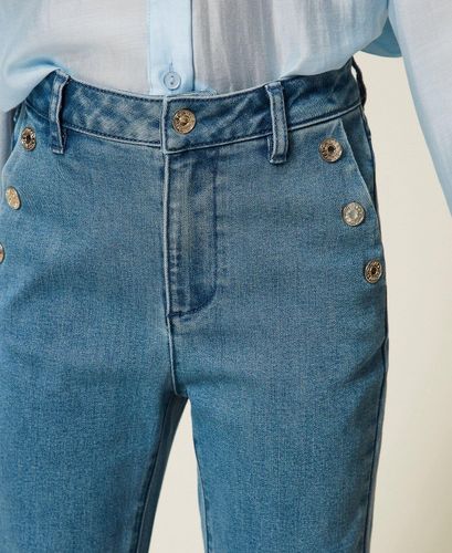 Flared jeans with buttons