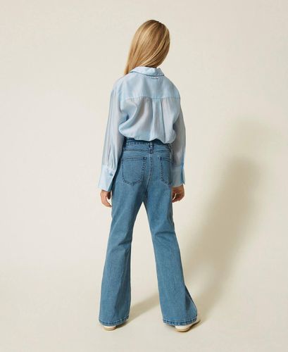 Flared jeans with buttons