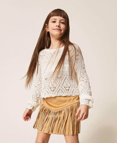 Short suede skirt with fringes