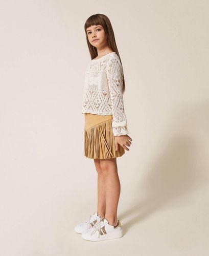 Short suede skirt with fringes