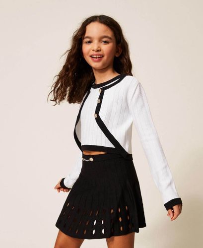 Short openwork knit skirt