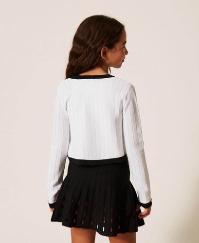 Short openwork knit skirt