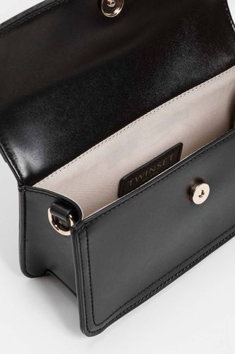 Shoulder bag with flap and logo