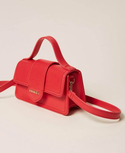 Shoulder bag with flap and logo
