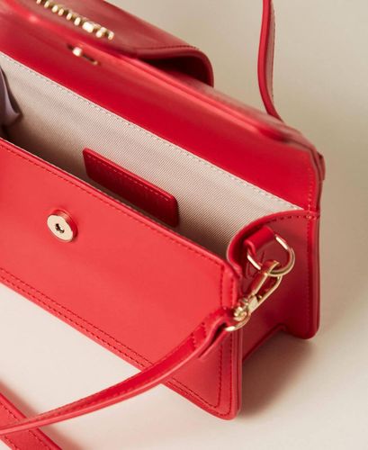 Shoulder bag with flap and logo