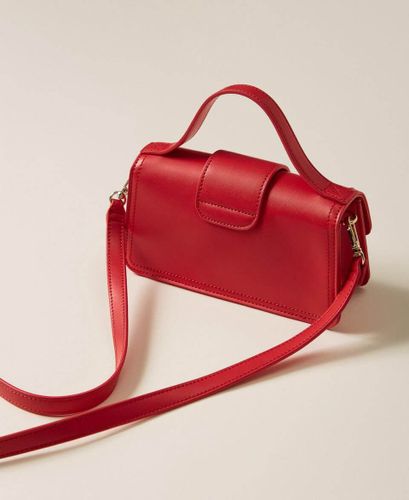 Shoulder bag with flap and logo