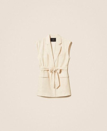Sleeveless jacket with print and belt