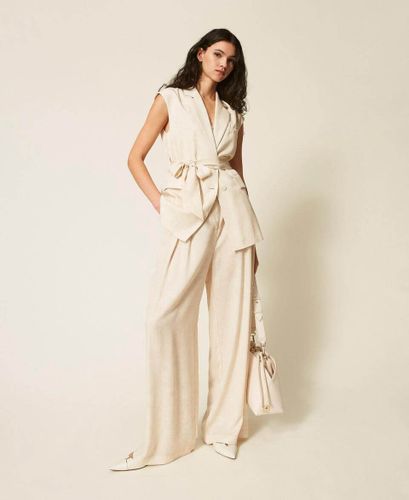 Sleeveless jacket with print and belt