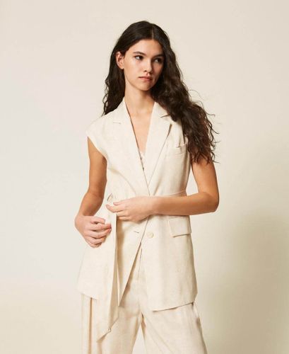 Sleeveless jacket with print and belt