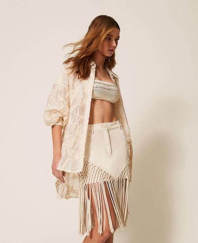 Bull denim miniskirt with fringes