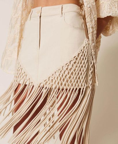 Bull denim miniskirt with fringes