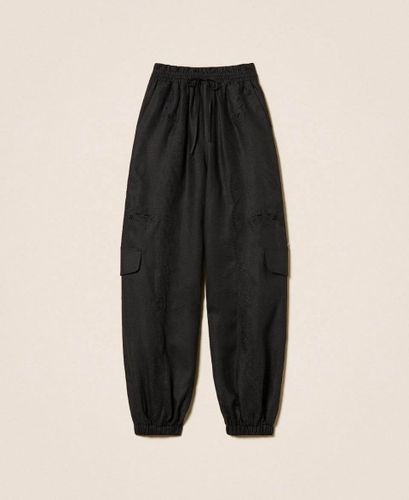 Linen and broderie anglaise jogger trousers