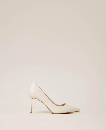 High heeled leather court shoes GIGLIO