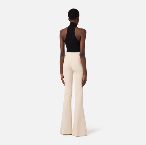 Trousers in lightweight crêpe fabric with cut-outs and slits
