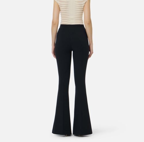 Trousers in lightweight crêpe fabric with cut-outs and slits