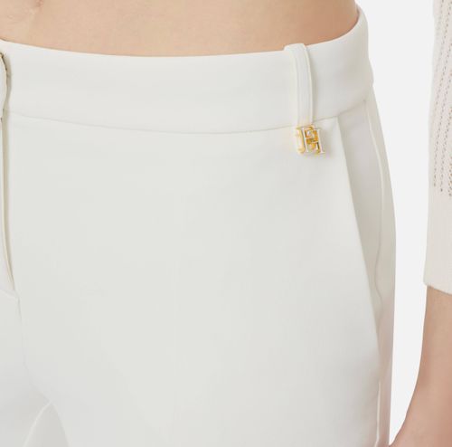 Trousers in lightweight crêpe fabric with logo charm