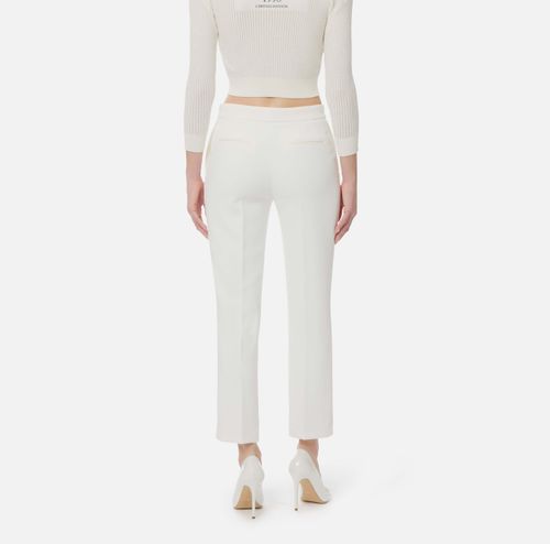 Trousers in lightweight crêpe fabric with logo charm