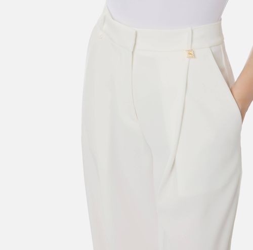 Trousers in lightweight crêpe fabric with logo charm