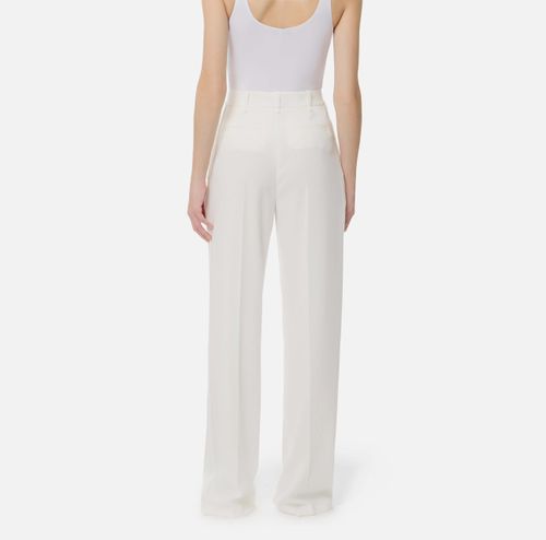 Trousers in lightweight crêpe fabric with logo charm