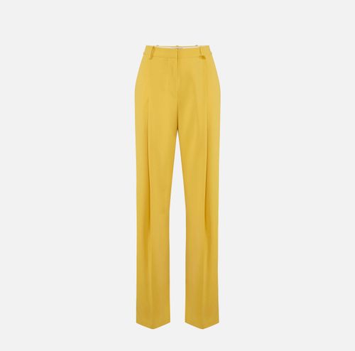 Trousers in lightweight crêpe fabric with logo charm