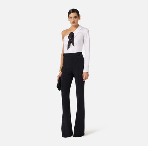 Trousers in double layer stretch crêpe fabric with logo charm