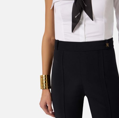 Trousers in double layer stretch crêpe fabric with logo charm