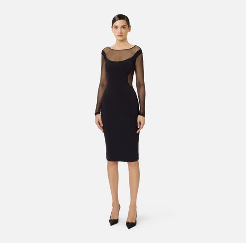 Dress in lightweight crêpe and tulle fabrics with cut-outs
