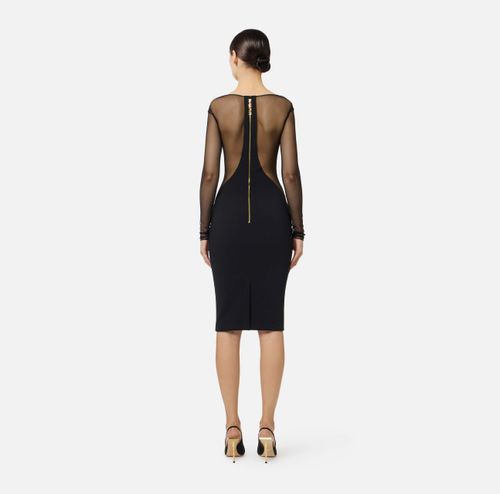 Dress in lightweight crêpe and tulle fabrics with cut-outs