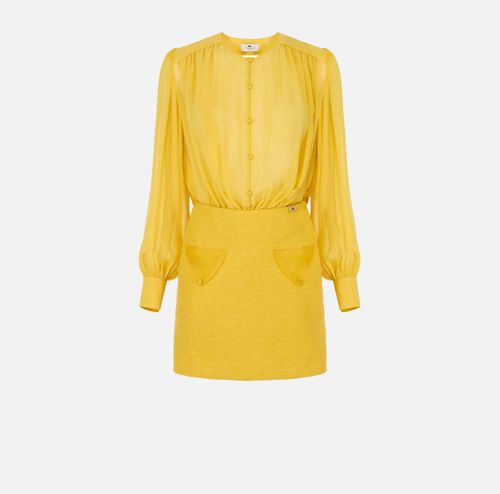 Dress in georgette and bouclé tweed fabrics