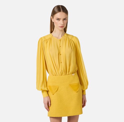 Dress in georgette and bouclé tweed fabrics