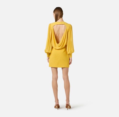 Dress in georgette and bouclé tweed fabrics