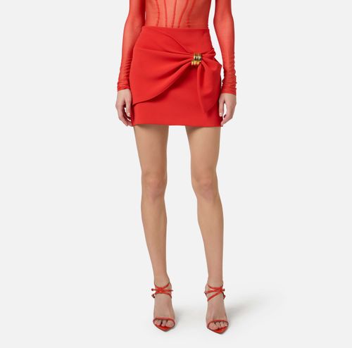 Miniskirt with jewel detail