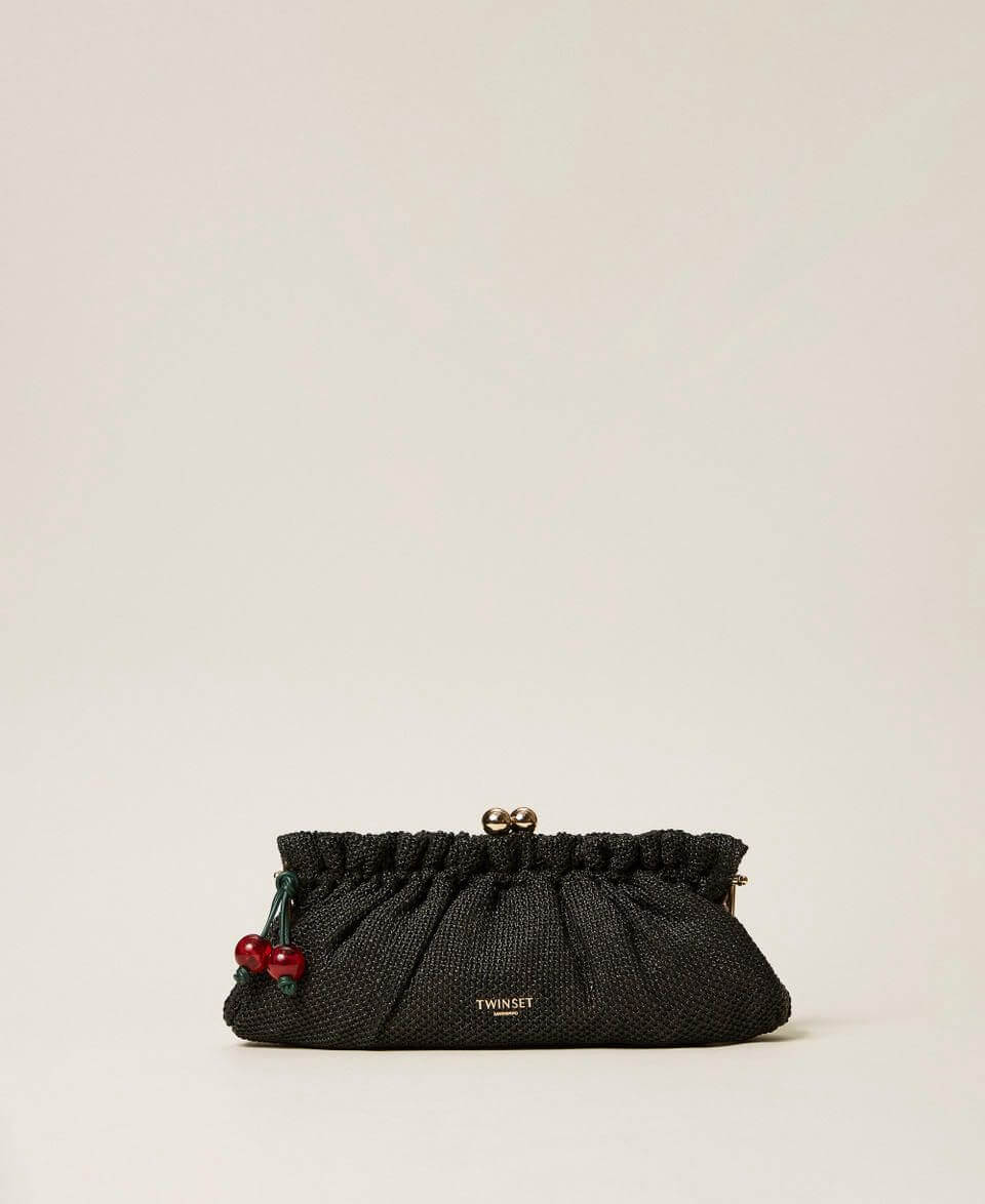 Raffia clutch with charm