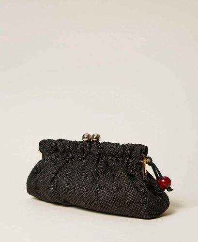 Raffia clutch with charm