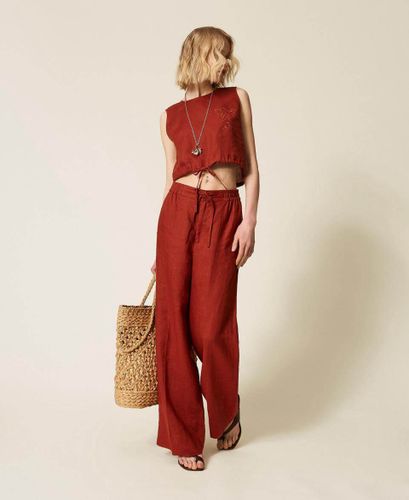 Linen trousers with embroidered logo