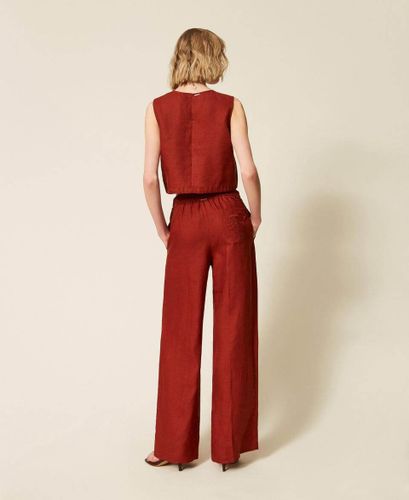 Linen trousers with embroidered logo