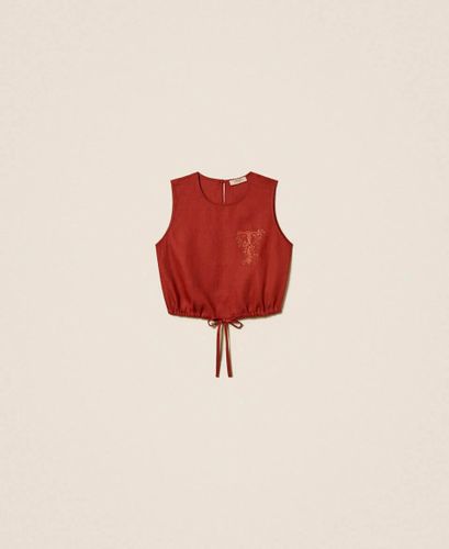 Linen top with embroidered logo