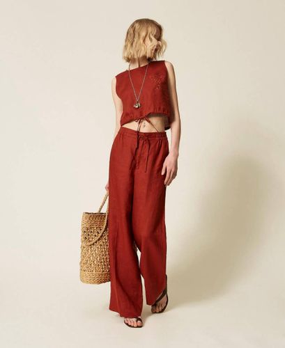 Linen top with embroidered logo