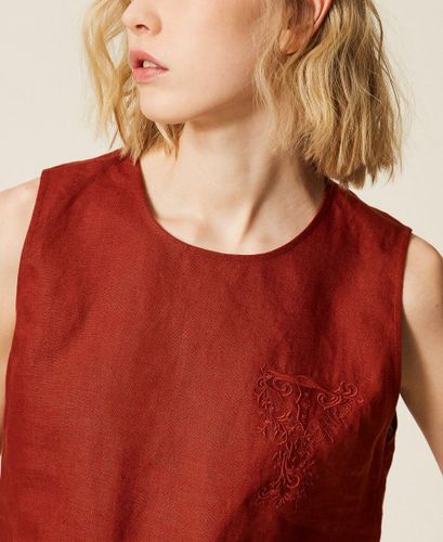 Linen top with embroidered logo