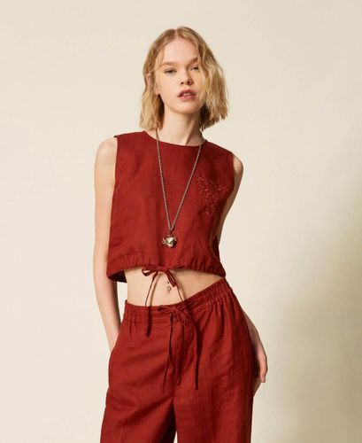 Linen top with embroidered logo