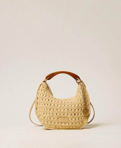 Raffia 'Croissant' bag with charms