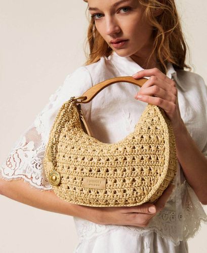 Raffia 'Croissant' bag with charms