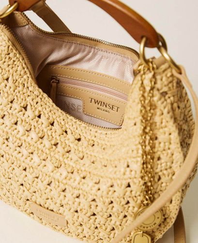 Raffia 'Croissant' bag with charms